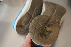 soles nearly worn through on walking shoes