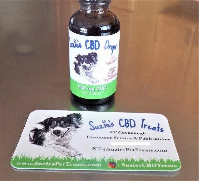 suzie's cbd treats cbd drops bottle and business card