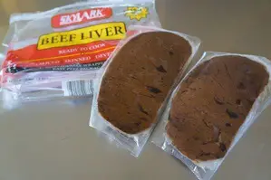 2 pieces of frozen liver wrapped in clear plastic packaging