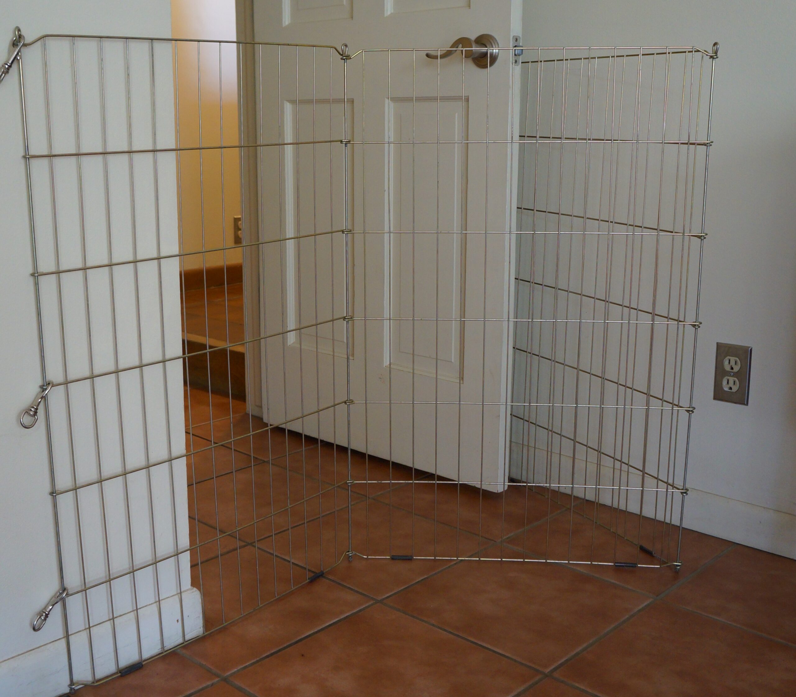 foster puppy set up - photo of x-pen blocking office doorway