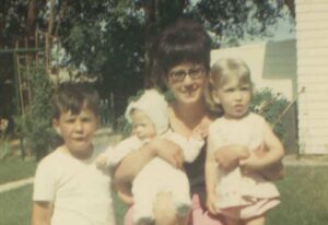 vintage photo of mother and 3 children from the 60s