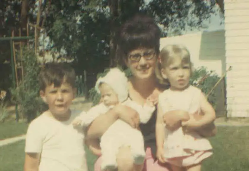 vintage photo of mother and 3 children from the 60s
