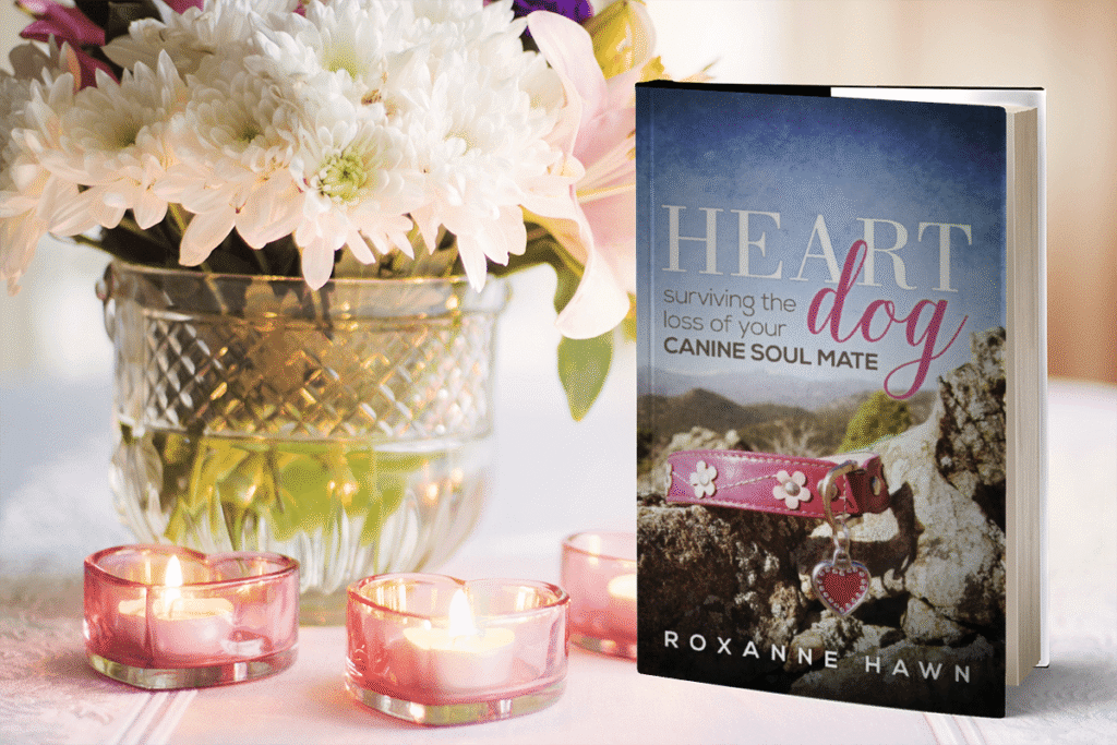heart dog surviving the loss of your canine soul mate by roxanne hawn book cover with flowers and votive candles it's on a page where you can order an autographed copy of heart dog
